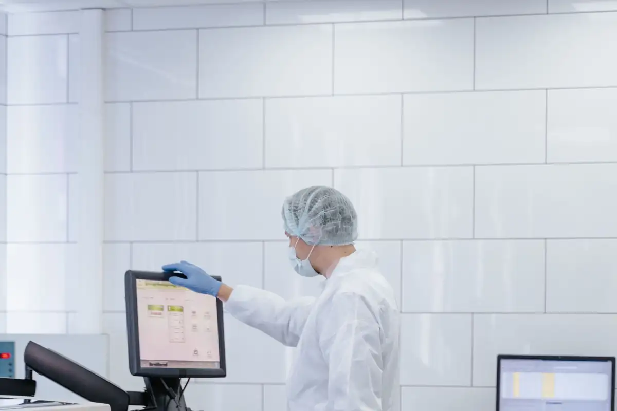 Lab technician checking equipment status