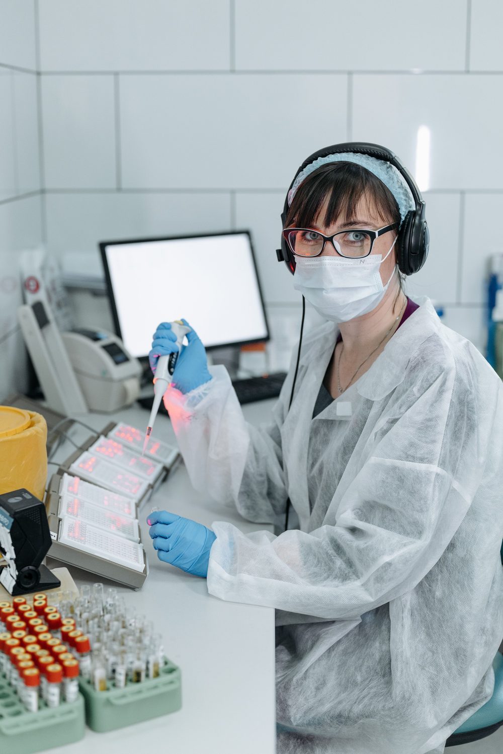 Technician pipetting a diagnostic sample